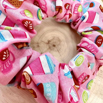 Pink scrunchie with coffee and matcha patterns