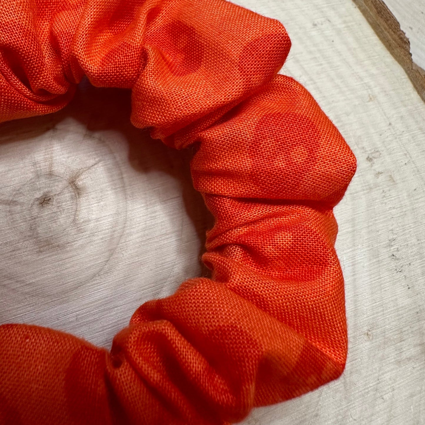 Orange scrunchie with skulls