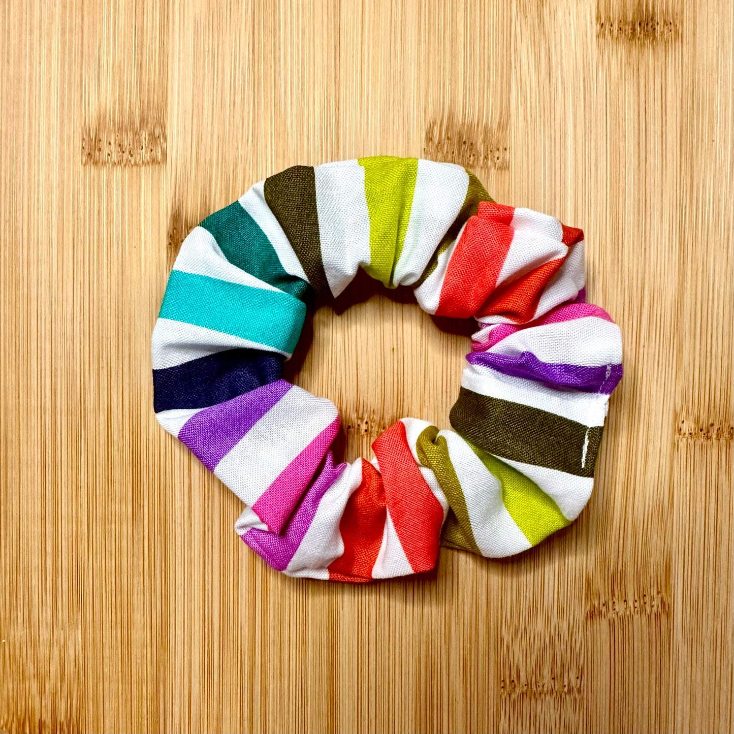 White scrunchie with multicolored stripes