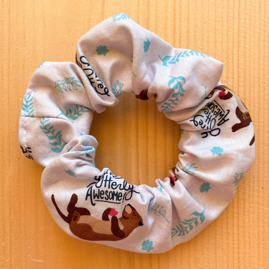 White scrunchie with otters