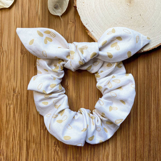 Chouchou cheveux à boucle blanc avec feuilles dorées