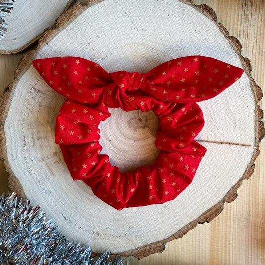 Red bow scrunchie with small golden stars